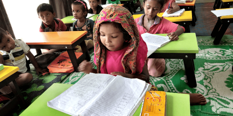 Children learning at a community center in India.