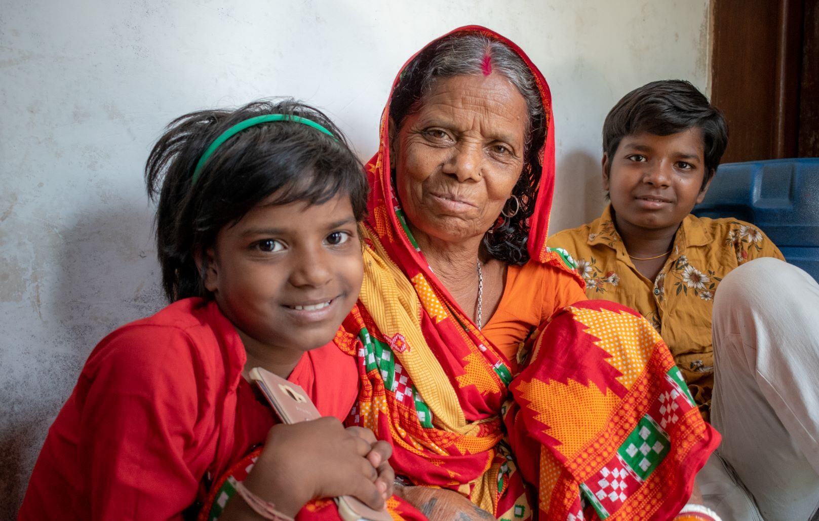 Grandmother with 2 children in India