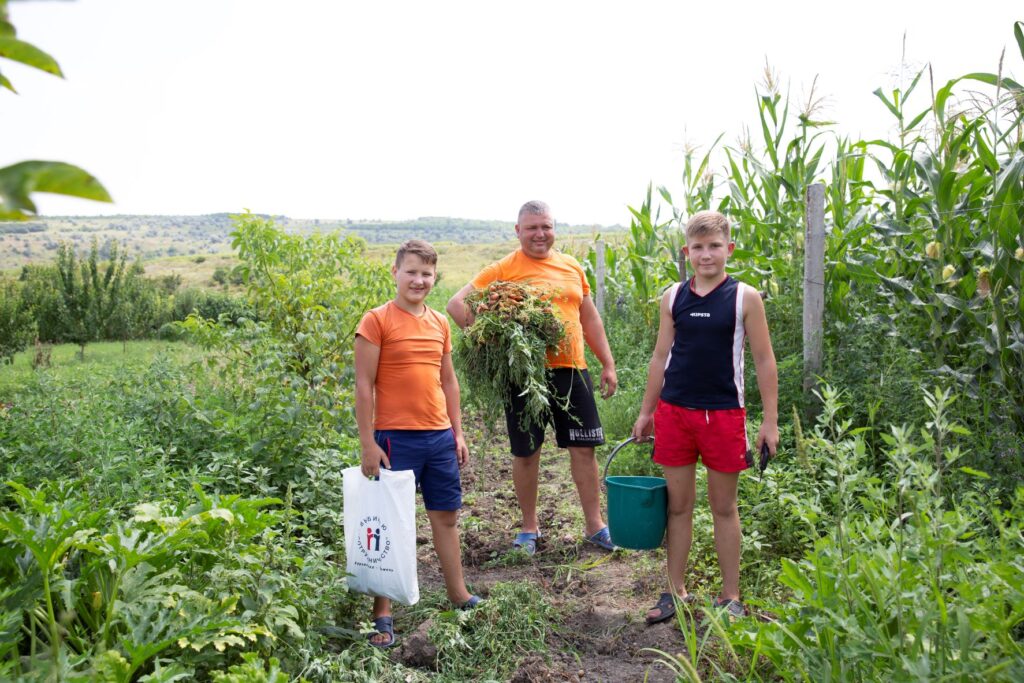 Moldovan dad gardening with children
