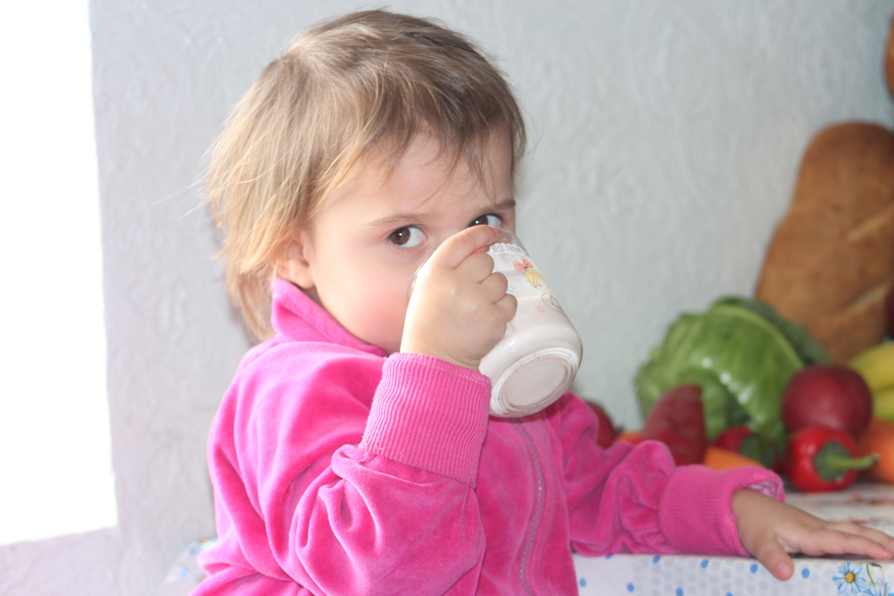 Moldovan child drinking from a cup