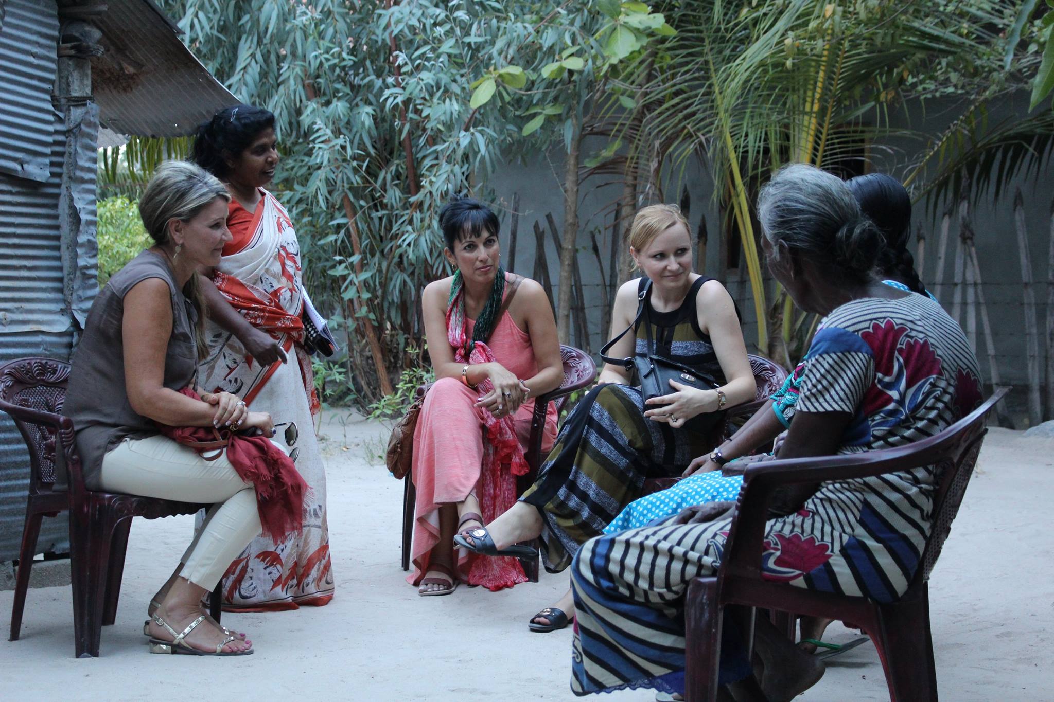 Donna visiting with a family in Sri Lanka (2016).