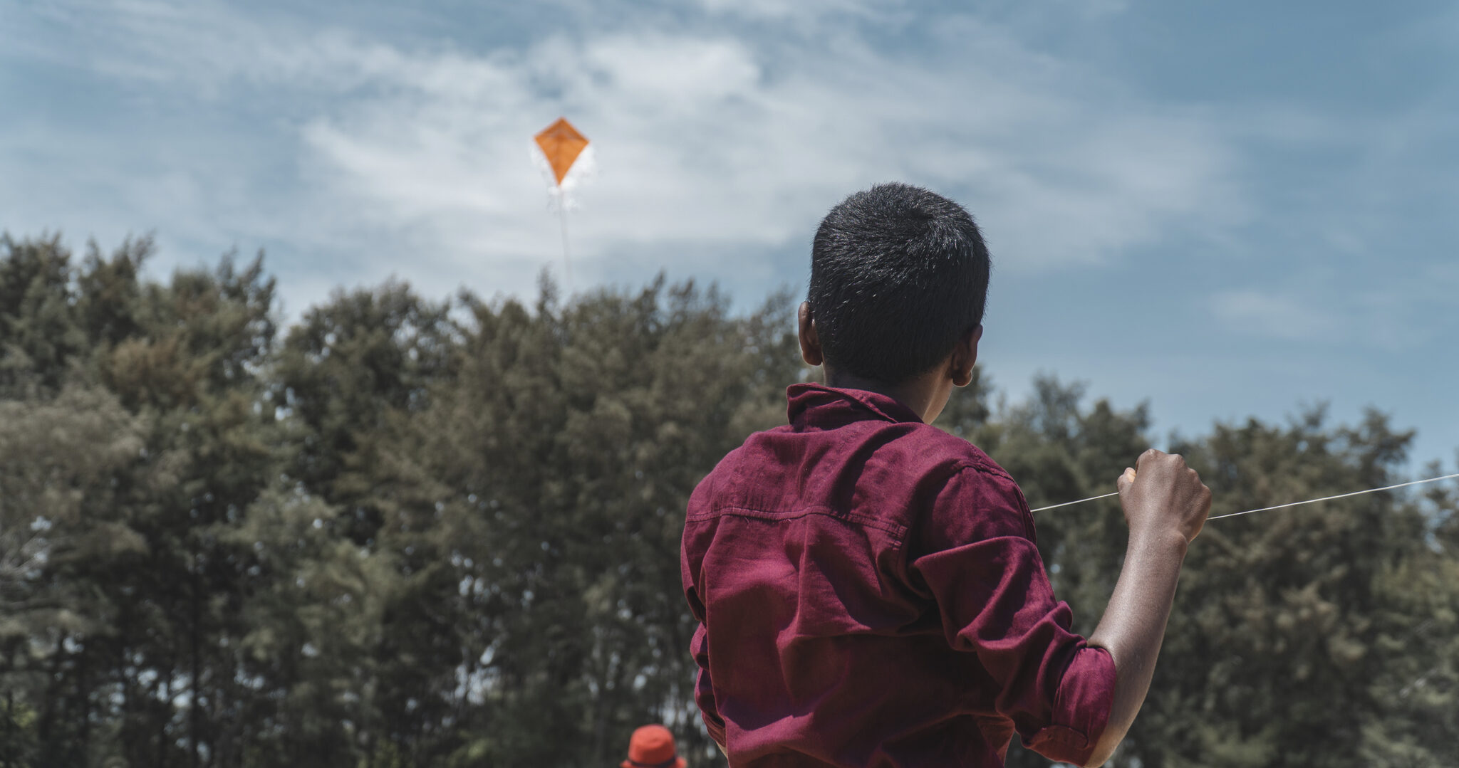 Child flying a kite in Sri Lanka