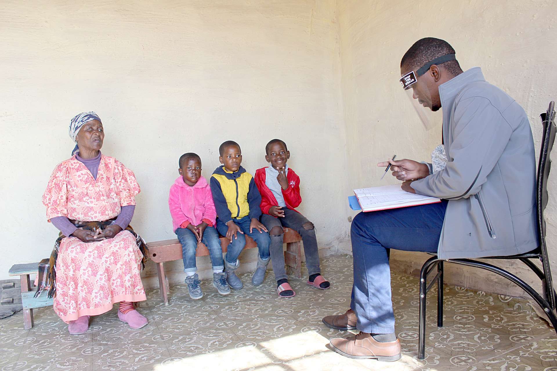 Mhambi with her great grandchildren and CERI team member