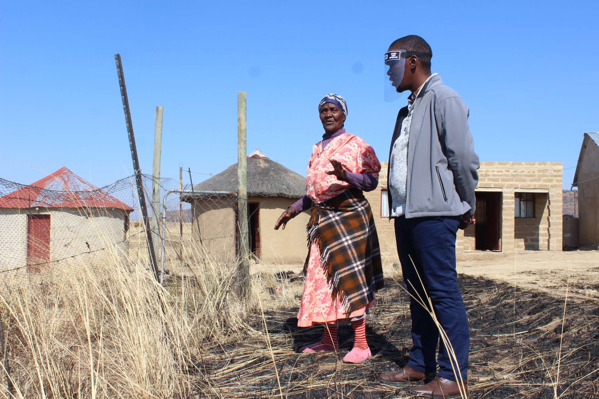 Mhambi outside her home with CERI team member