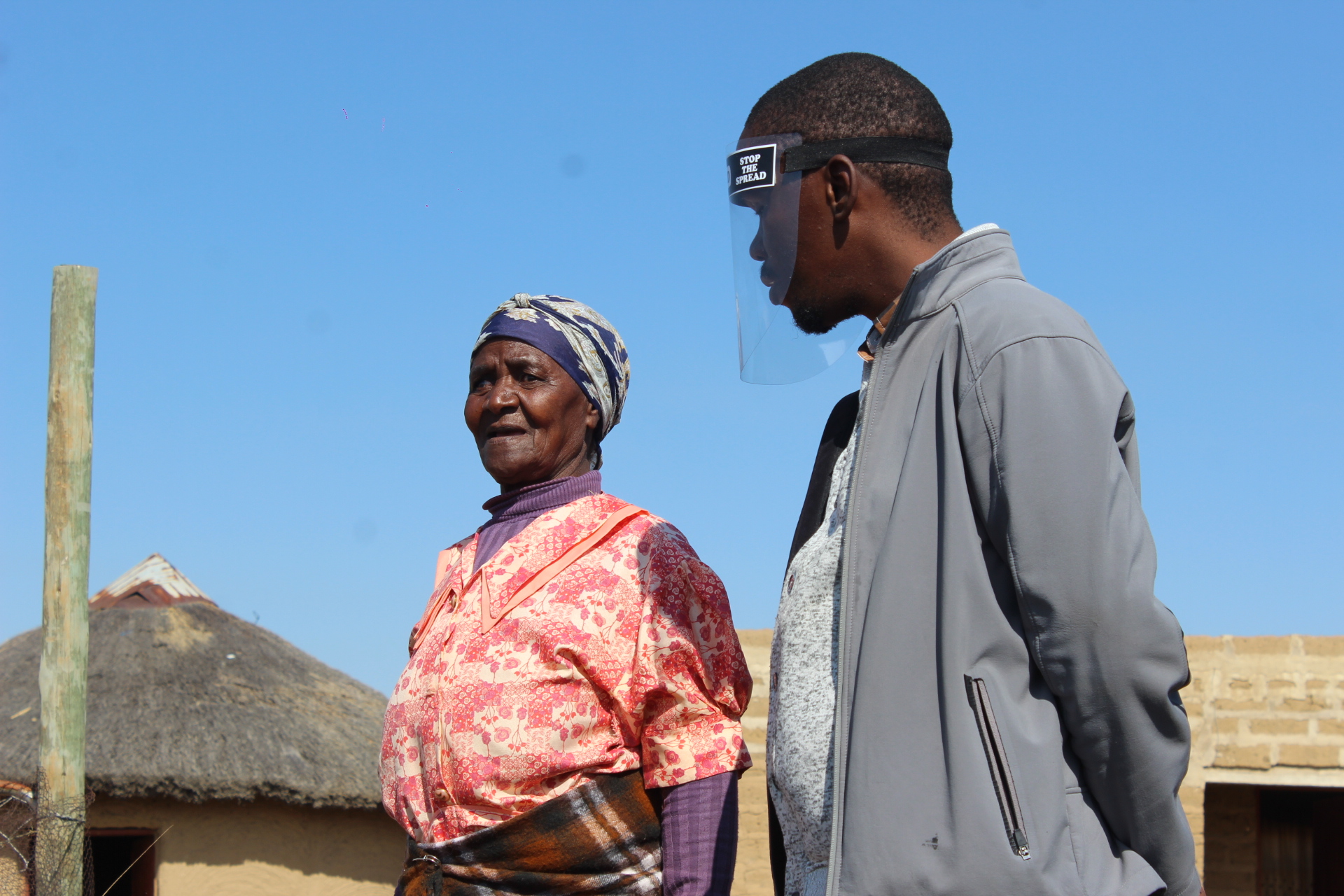 Mhambi outside her home with CERI team member
