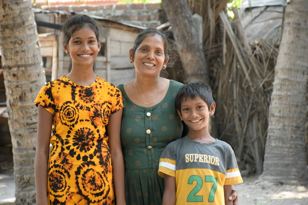 family from Sri Lanka standing happily together